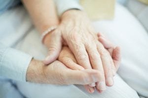 mesothelioma patients holding hands